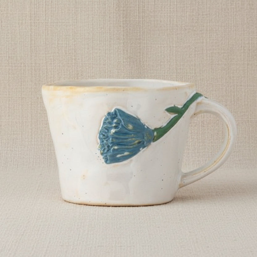 Loua mok met blauwe bloem